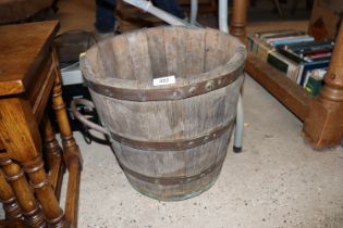 An oak and coopered log bin