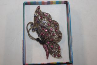 A large costume brooch in the form of a butterfly