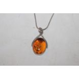A vintage Sterling silver and amber pendant on cha