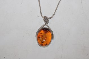 A vintage Sterling silver and amber pendant on cha