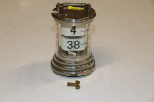 A mid-20th Century chrome plated clock of cylindri