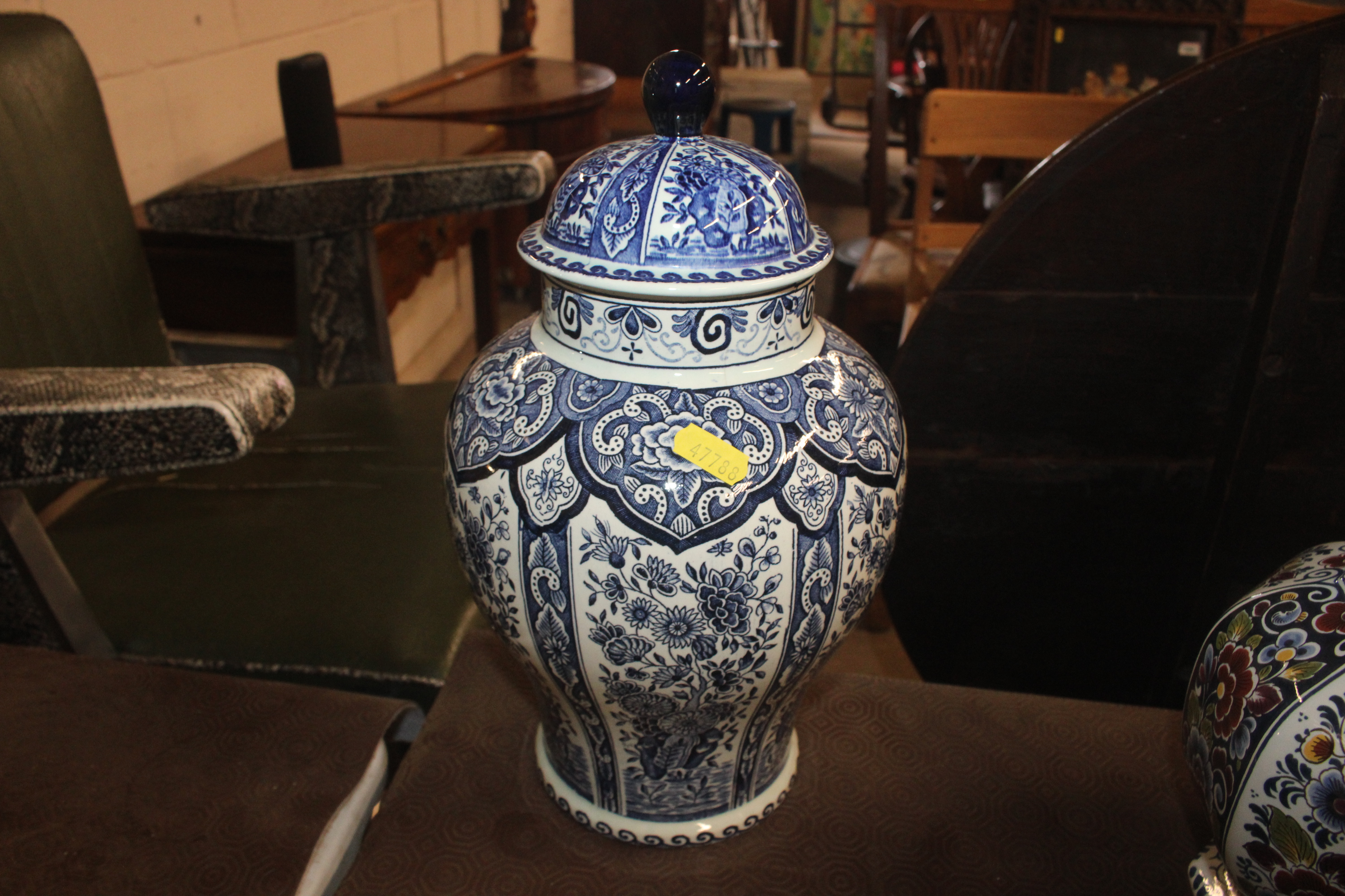 A Delft baluster vase and lid; a charger and three - Image 9 of 12