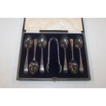 A cased set of six silver teaspoons and sugar tong