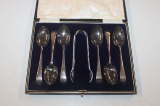 A cased set of six silver teaspoons and sugar tong