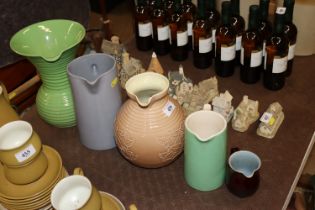 A quantity of jugs to include stoneware, Lovatts,