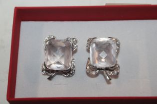 A pair of large Sterling silver diamond and rose q
