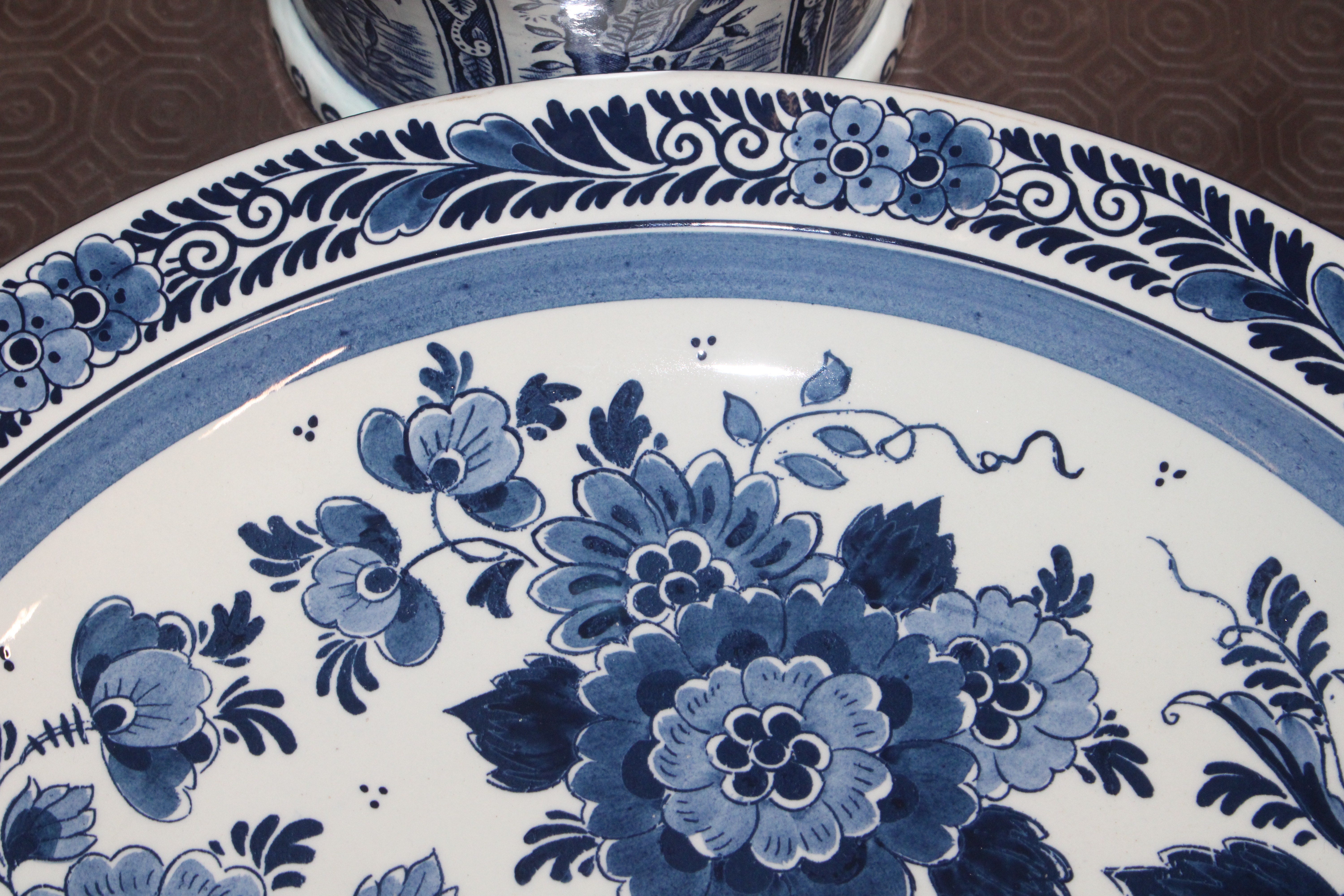 A Delft baluster vase and lid; a charger and three - Image 7 of 12