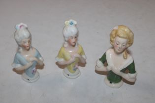 Three porcelain pin dolls