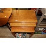 A nest of three oak occasional tables