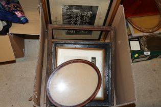 A box containing various photos and frames