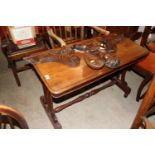 A 19th Century mahogany side table raised on stret