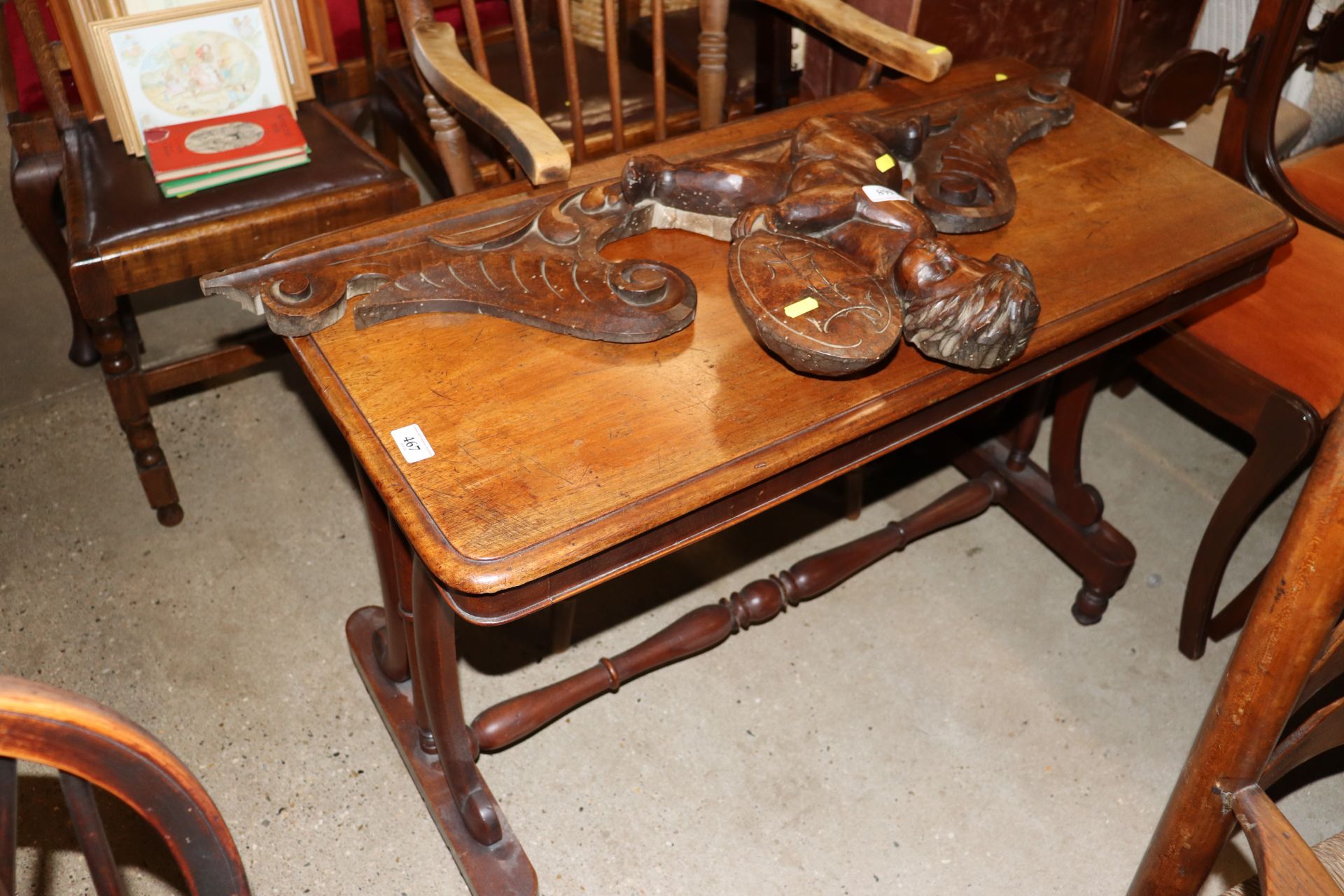 A 19th Century mahogany side table raised on stret