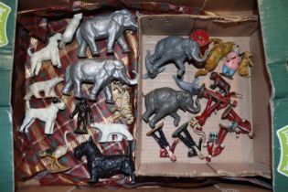 A box containing various farm animals, circus anim