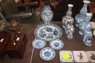 A Delft baluster vase and lid; a charger and three