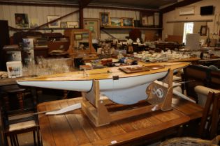 A large radio controlled boat on stand