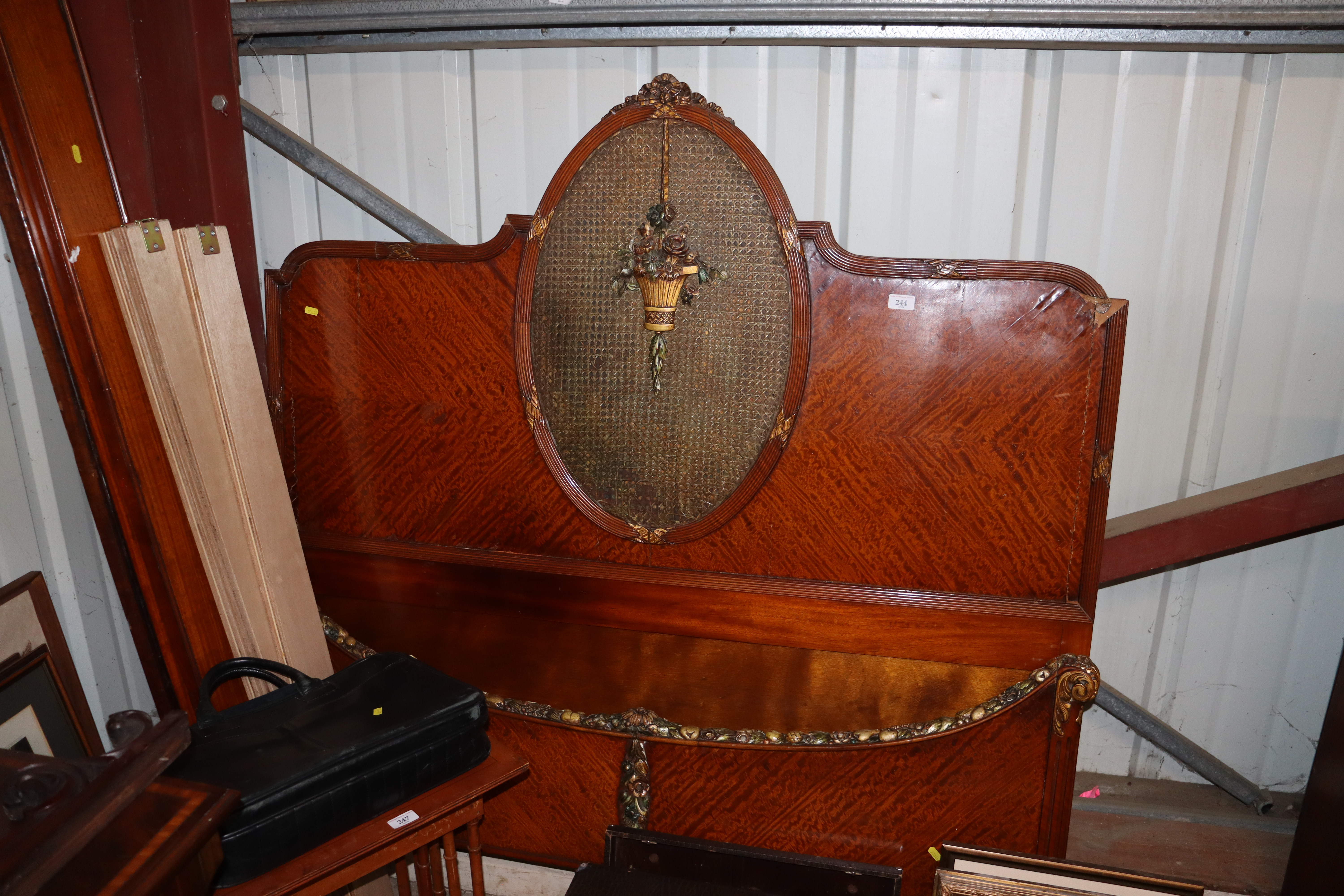 A French walnut bedstead with wicker panel and app