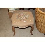 A 19th Century upholstered dressing table stool wi