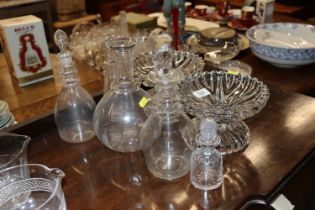 A quantity of decanters - some lacking stoppers; a