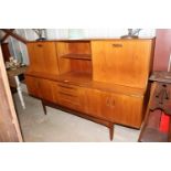 A G-plan sideboard fitted three central drawers, f