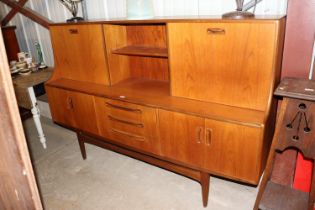 A G-plan sideboard fitted three central drawers, f