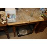 A pine table fitted single drawer, raised on turne