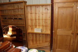 A pine open fronted bookcase with three adjustable