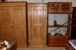 A pine single door wardrobe fitted single drawer b