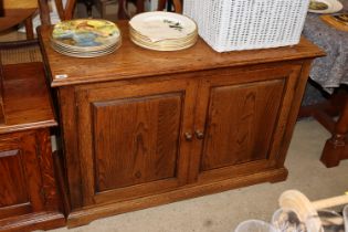 A Period Oak Reproductions Ltd. tv cabinet