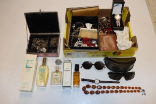 A box containing various jewellery, wrist watches