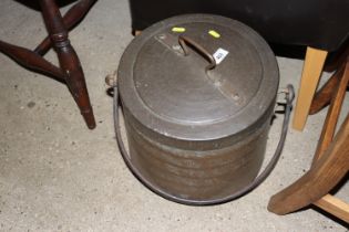 A copper cooking pot with swing handle