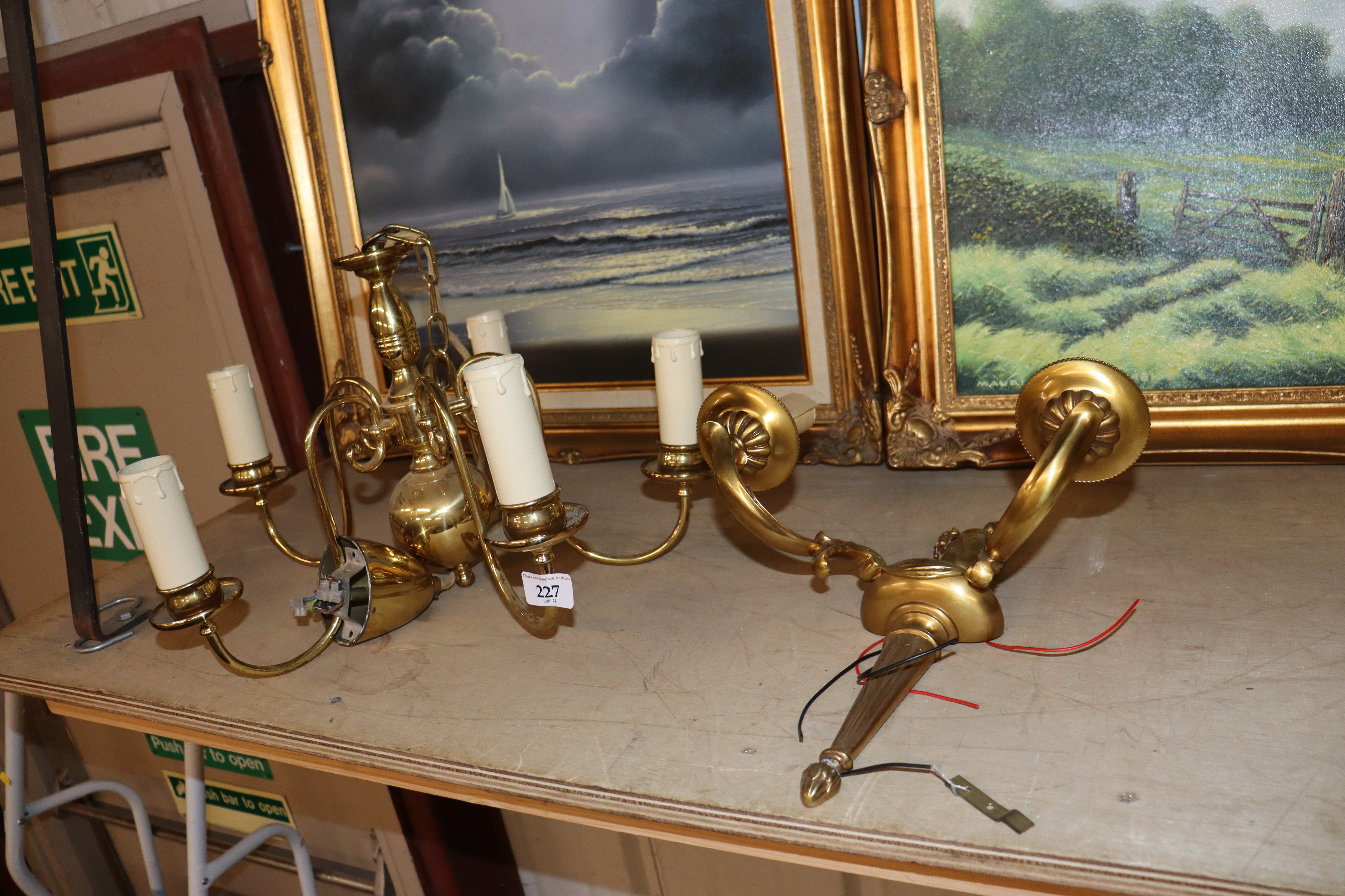 A twin branch light fitting and a brass five branc
