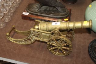 A large brass model of a field cannon