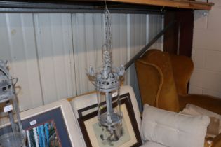 A metal and glass hanging lantern