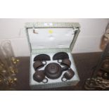 A cased Chinese Yixing tea set with impress seal m