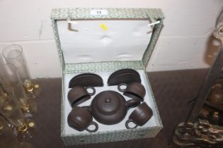 A cased Chinese Yixing tea set with impress seal m