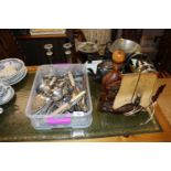 A box of various flatware, silver plated candlesti