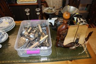 A box of various flatware, silver plated candlesti