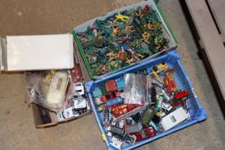 Three boxes containing various toys to include die