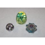 A Strathearn glass paperweight and two others