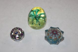 A Strathearn glass paperweight and two others