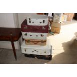 Six various suitcases