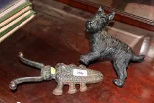 A door stop in the form of a dog; and a Beetle boo