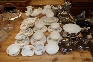 A quantity of crescent floral decorated bone china