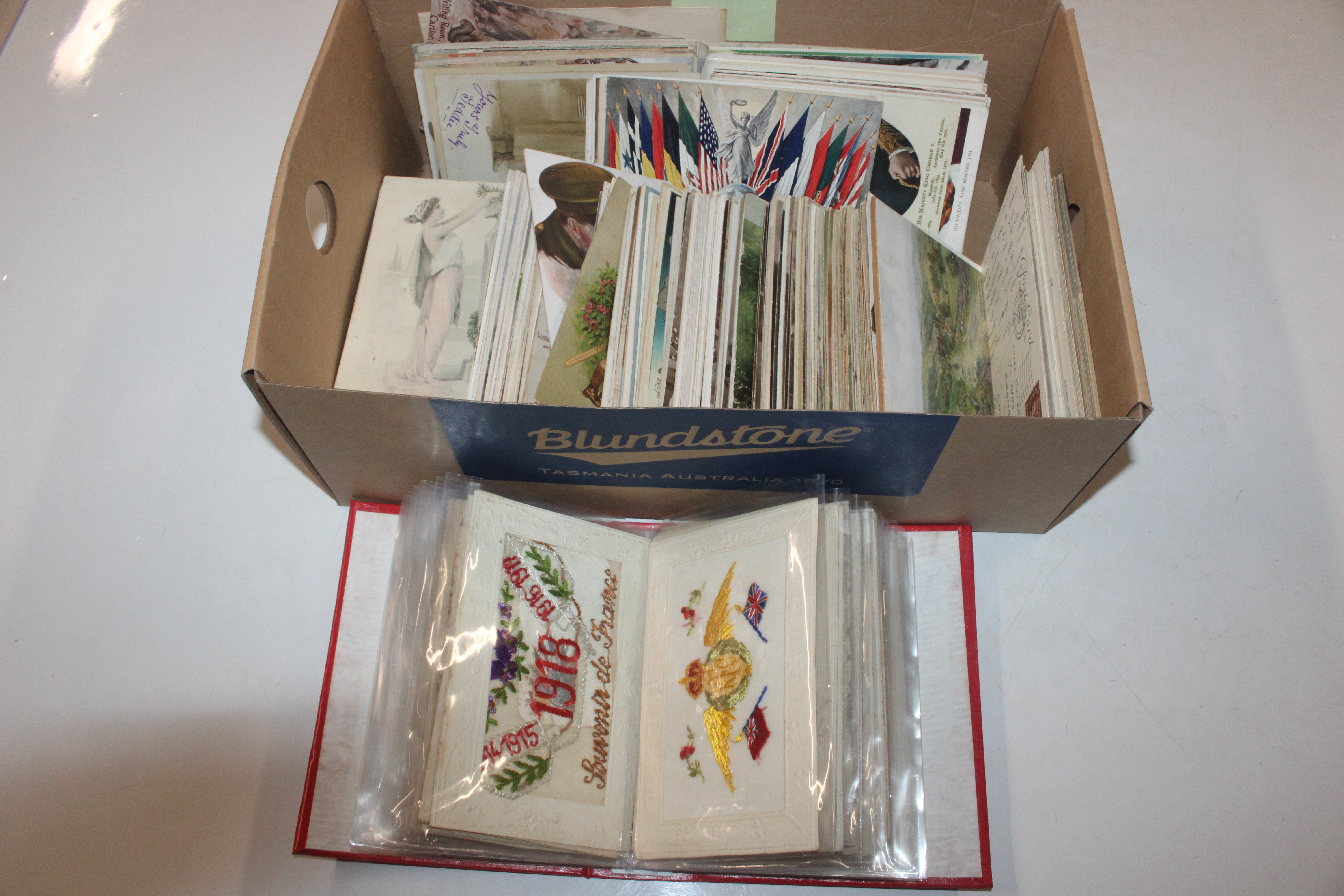 A box containing various post-cards to include Art