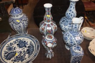 A Delft brightly coloured baluster vase; a jar and