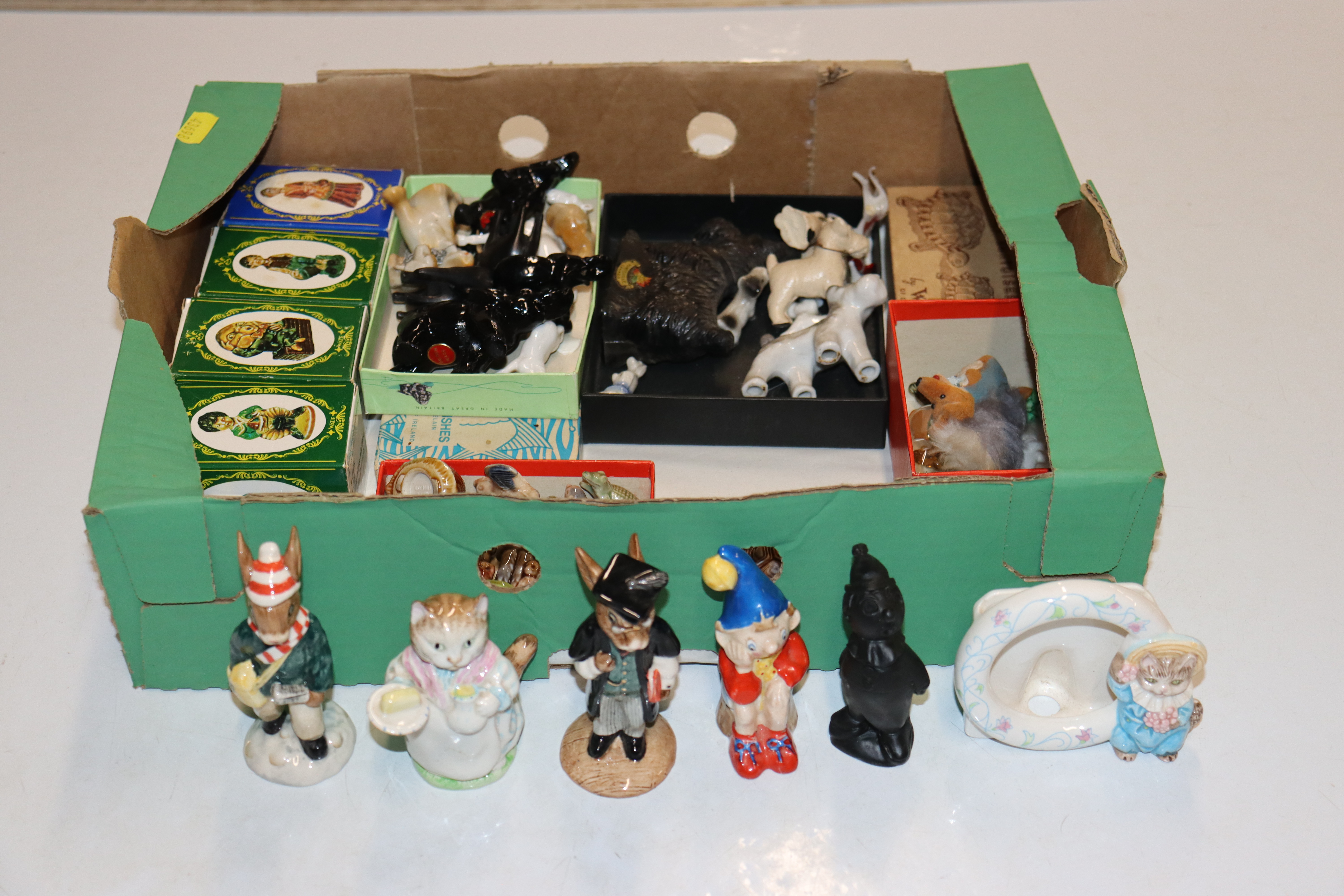 A box containing Wade Whimsies; Royal Doulton "Sch