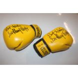 A pair of boxing gloves, signed "With Best Wishes,