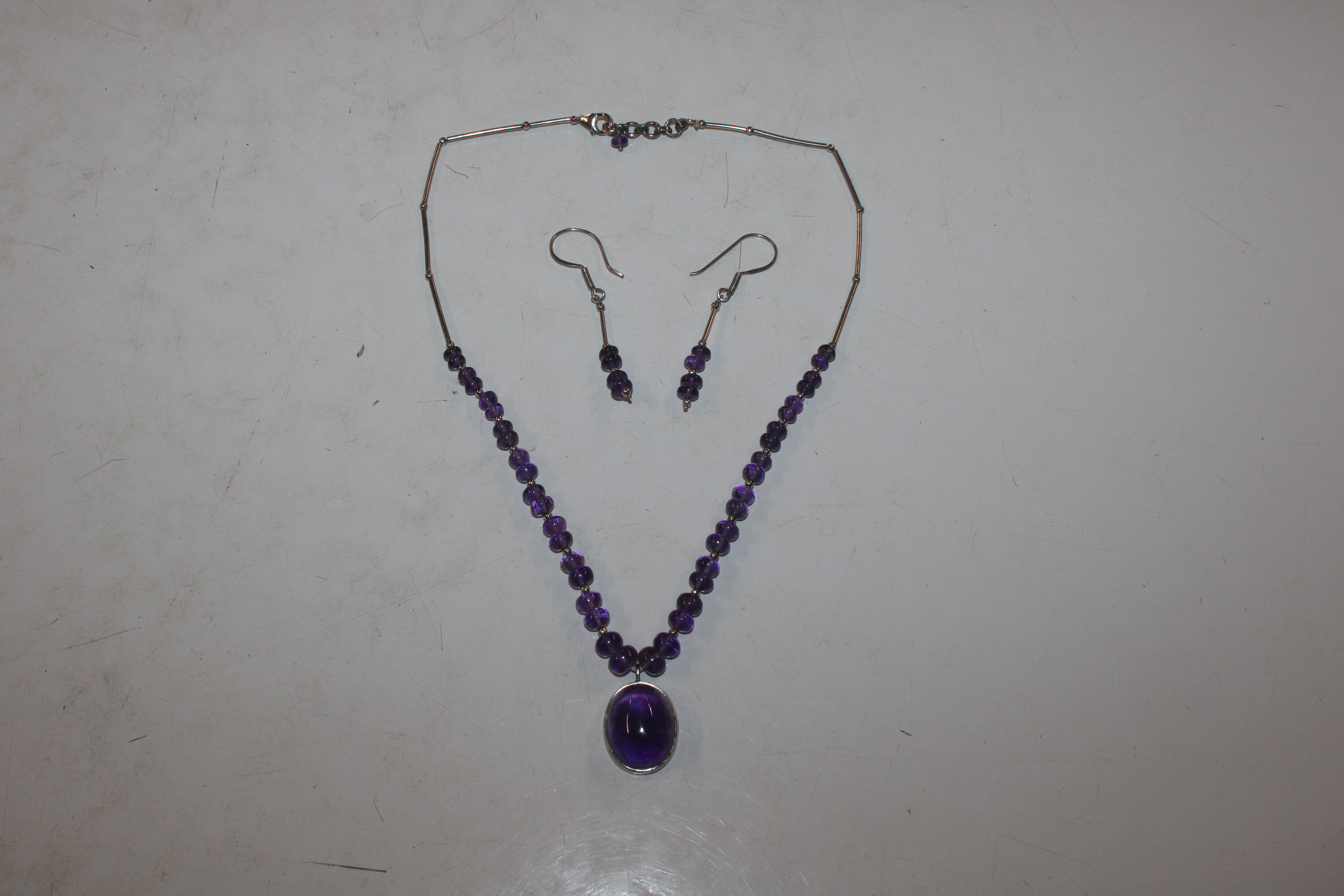 A Sterling silver amethyst set necklace and ear-ri