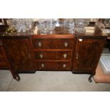 A mahogany sideboard fitted three central drawers