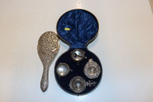 A case containing two silver salts and one spoons,